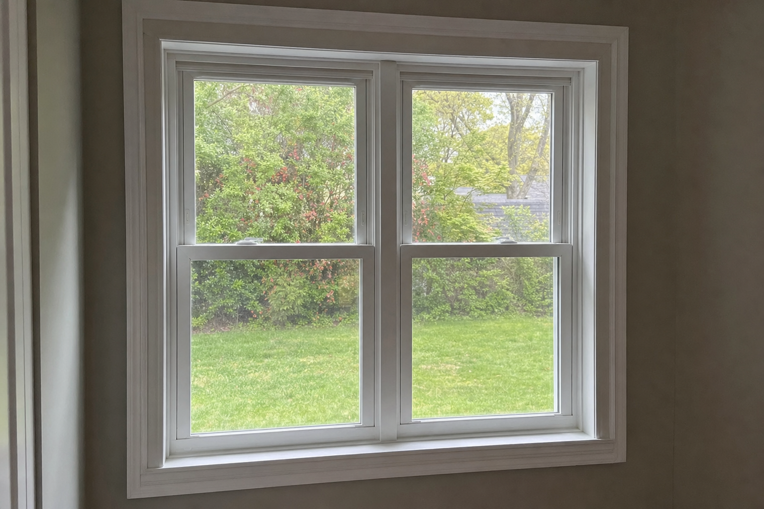 Newly installed double-hung vinyl window viewed from the interior of a Long Island home
