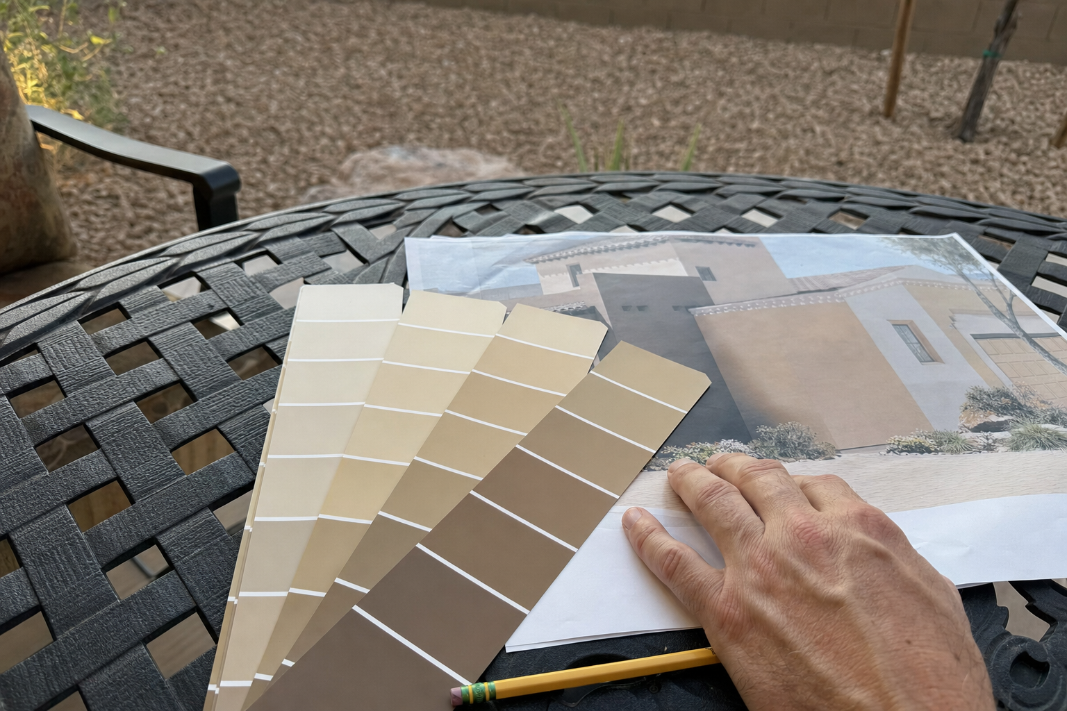 Desert-toned paint swatches next to an HOA guideline sheet